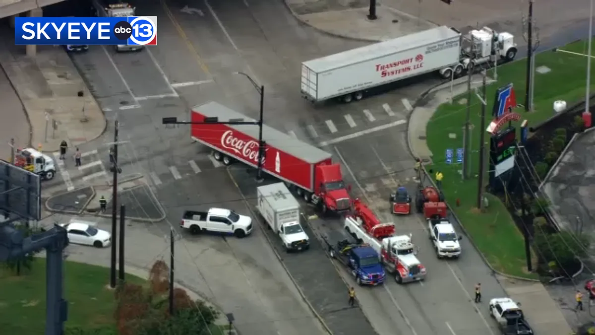 Crash involving 2 big rigs, 3 cars and motorcycle shuts down intersection, Baytown PD says