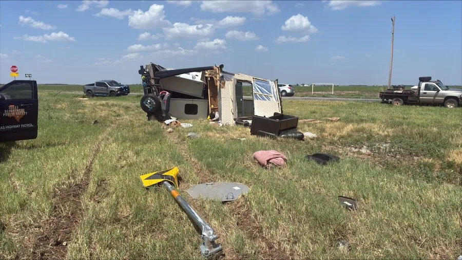 Vehicle towing camper overturns north of Tye