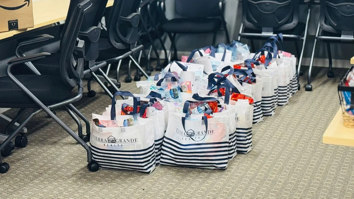 Taylor Chamber giving welcome bags to new teachers
