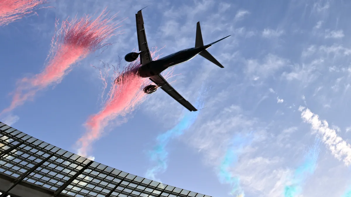 Dramatically low flyby by passenger jets over packed South African stadium sparks safety debate