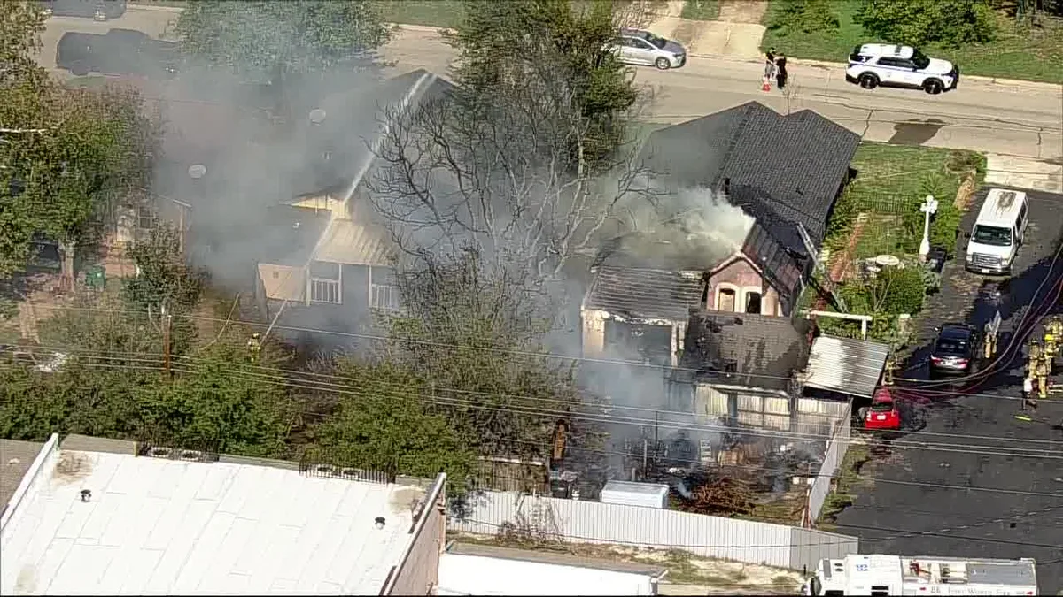 Fort Worth fire damages home and sheds