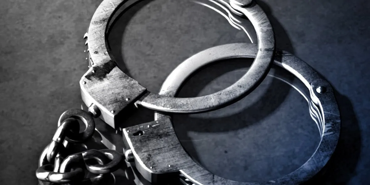 Driver arrested after car catches fire in crash with truck