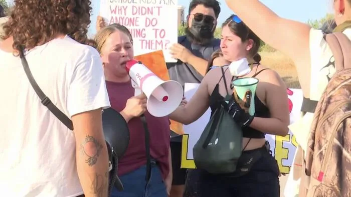 Protesters rally outside ICE Processing Center in Pearsall