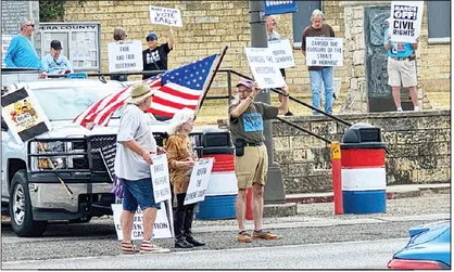 Protest draws over 30 to courthouse