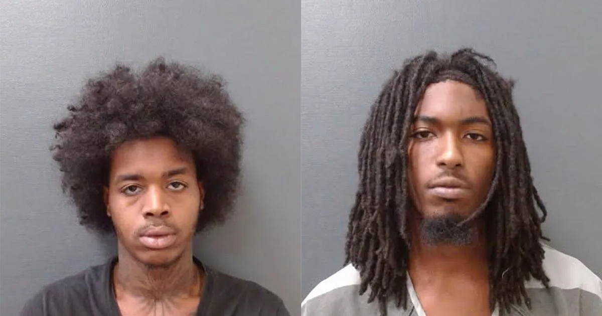 Two charged with aggravated robbery of woman after she left bank