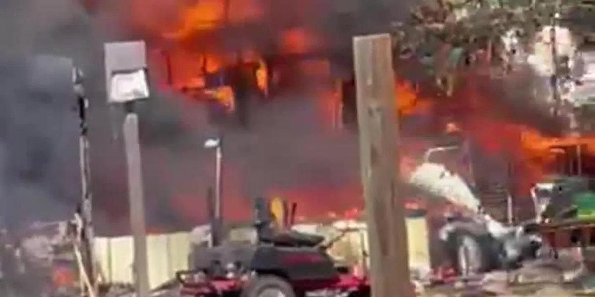 Structure fire spreads to nearby grass west of Somerville
