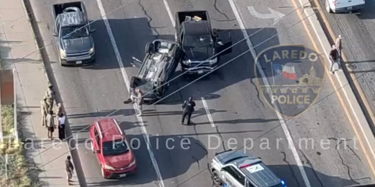 Vehicle rollover closes lanes on Mines Rd.