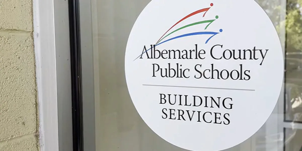 Assistant superintendent placed on leave after staff member claims he repeatedly projected a photo of her in a college dance team uniform at meetings