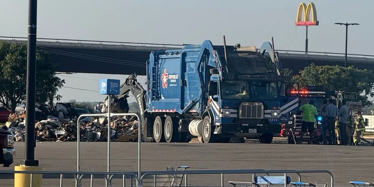 Driver dumps trash in Walmart parking lot after spotting smoke in the back of his truck