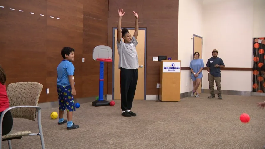 Texas women's hoops visits children's hospital