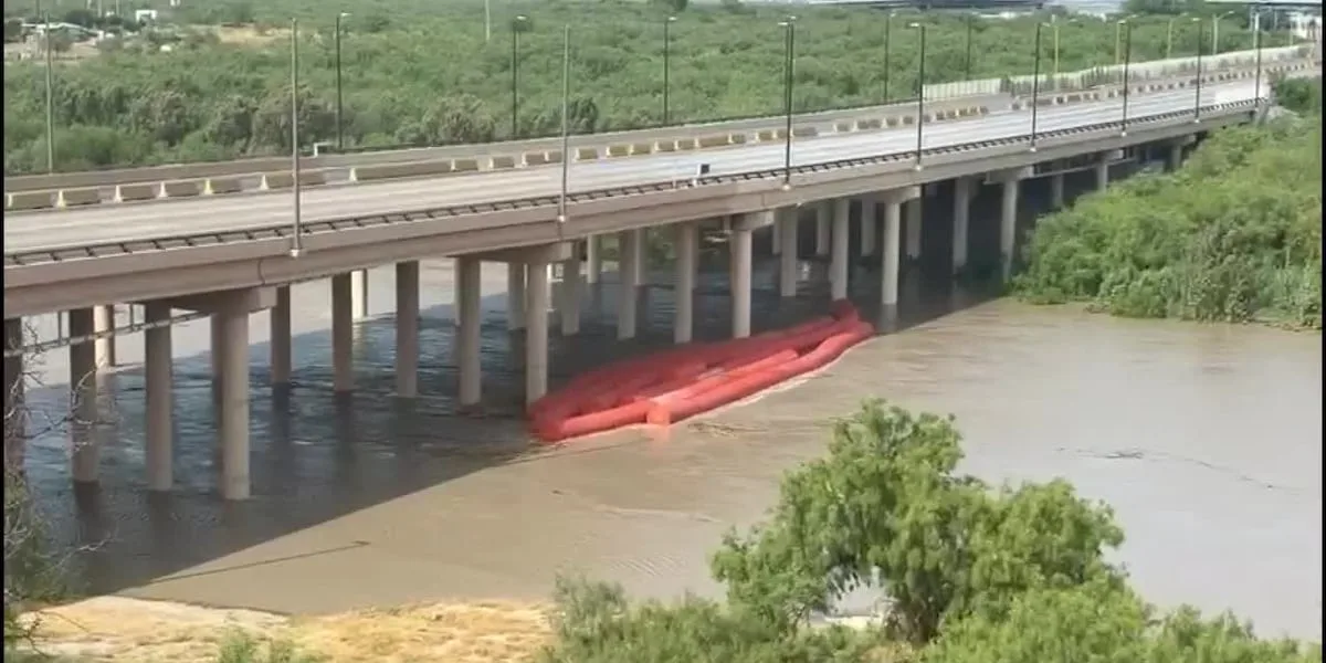 Traffic at World Trade International Bridge temporarily suspended after buoy barrier accumulates near supports