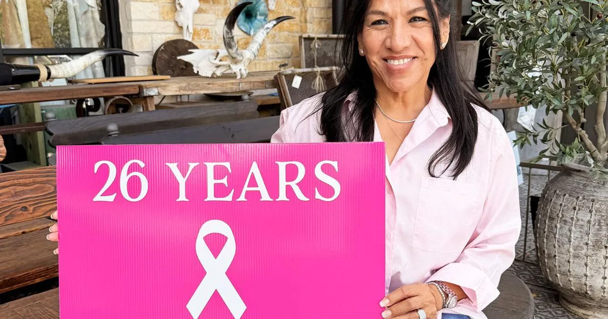 Seeing pink: Local business owner displays signs to mark 26 years as a breast cancer survivor