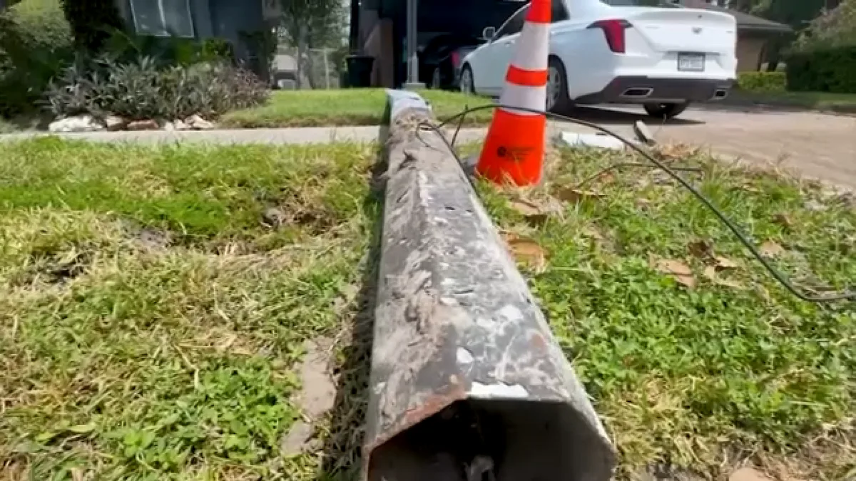 Homeowner says light pole knocked down by car left on sidewalk for weeks until Action 13 stepped in